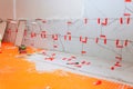 Tile installation process in kitchen renovation with marble tiles tools on floor Royalty Free Stock Photo