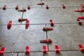 Tile Installation Process with Red Clamps and Spacers on Gray Floor Surface Royalty Free Stock Photo
