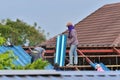 Blue roman tile roof are roofed by the workers for home renovation. Royalty Free Stock Photo