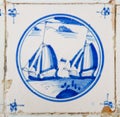 Tile with painting of sailing ships Royalty Free Stock Photo