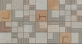 Tile pattern featuring a grid of square tiles in warm earth tones, including beige, Royalty Free Stock Photo