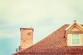 Tile roof with chimney against sky Royalty Free Stock Photo