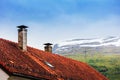 Tile roof with chimneys and antenna Royalty Free Stock Photo