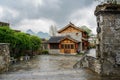 Tile-roofed buildings at ancient town after rain in cloudy spring Royalty Free Stock Photo