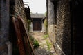 Tile-roofed houses in ancient alley on sunny spring