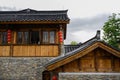 Tile-roofed timberwork buildings in cloudy spring after rain