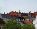 Tile roofs of Bergen, Norway and green street lamp Royalty Free Stock Photo