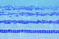 Tile stairs in the blue water of the pool Royalty Free Stock Photo
