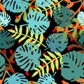Tile tropical vector pattern with green exotic leaves on black background