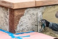 Tile Worker Applying Cement with Trowel at Pool Construction Site Royalty Free Stock Photo