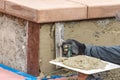 Tile Worker Applying Cement with Trowel at Pool Construction Site Royalty Free Stock Photo