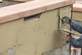 Tile Worker Applying Cement with Trowel at Pool Construction Site Royalty Free Stock Photo