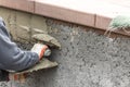 Tile Worker Applying Cement with Trowel at Pool Construction Site Royalty Free Stock Photo