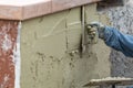 Tile Worker Applying Cement with Trowel at Pool Construction Site Royalty Free Stock Photo