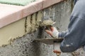 Tile Worker Applying Cement with Trowel at Pool Construction Site Royalty Free Stock Photo