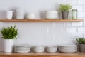 Tiled background and shelves with dishes. Different tableware backdrop. Dishes in cupboard in kitchen. Kitchenware. Kitchen