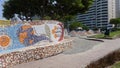 Tiled bench and exterior buildings in a park of Lima