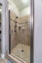 Tiled brown shower cubicle in the bathroom