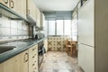 tiled kitchen with super kitsch tiles and wooden table