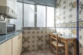 tiled kitchen with super kitsch tiles and wooden table