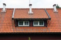 Tiled mansard roof of house in Nida, Lithuania Royalty Free Stock Photo