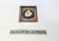 Tiled plaque with the name of Callejon de la Comedia street and Miguel de Cervantes portrait Royalty Free Stock Photo