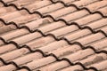 Tiled roof of the house wavy light brown sloping background