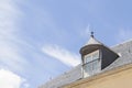 Tiled roof with mansard windows of attic rooms in antique European