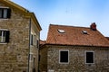 Tiled roof of an old house overlooking the sea and mountains Royalty Free Stock Photo