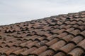 tiled roof supported on a double pitch roof, the old tiles tend to slip over time, because they are not fixed. Royalty Free Stock Photo