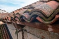 tiled roof supported on a double pitch roof, the old tiles tend to slip over time, because they are not fixed. Royalty Free Stock Photo