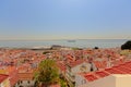 Tiled rooftops of the houses of Lisbon, with Tagus river in the backgrorundPortugal