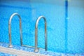 Tiled swimming pool with blue water