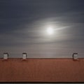 Tiled top of the roof, cloudy blue sky Royalty Free Stock Photo