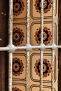 Tiled window with rusty iron lattice