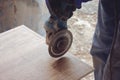 The tiler cuts tiles professionally and efficiently with an angle grinder