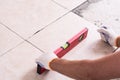 Tiler installing ceramic tiles Royalty Free Stock Photo