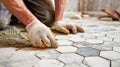 Tiler placing hexagonal marble tiles on bathroom floor Royalty Free Stock Photo