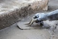 The tiler is working on smoothing the mortar surface. Royalty Free Stock Photo