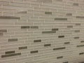 Tiles made of glass installed on the wall as decoration or kitchen backsplash