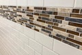 Tiles made of glass and stone installed on the wall as decoration or kitchen backsplash Royalty Free Stock Photo