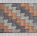 Tiles for outdoors and pavements, arranged transversely. Colors are orange,white and gray. Royalty Free Stock Photo