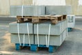 Tiles piled in pallets, warehouse paving slabs in the factory for its production