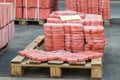 Tiles piled in pallets, warehouse paving slabs in the factory for its production