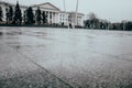 Tiles in the square of the city. Marble. Flooring. The central square of the city. Wet asphalt