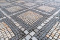 Tiles texture. Pattern of ancient german cobblestone in city downtown. Little granite paving stones. Antique gray pavements