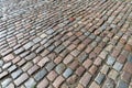 Tiles texture. Pattern of ancient german cobblestone in city downtown. Little granite paving stones. Antique gray pavements