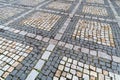 Tiles texture. Pattern of ancient german cobblestone in city downtown. Little granite paving stones. Antique gray pavements
