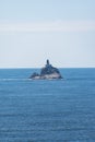 Tillamook Rock Lighthouse sits on a basalt rock island out in the ocean Royalty Free Stock Photo