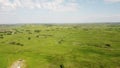 Tilt down shot of rolling hills and ranching farms